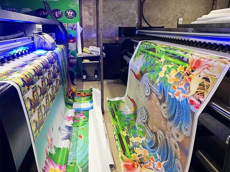 In chuyển nhiệt khổ lớn, được sử dụng trong ngành in dệt may, là một công nghệ in ấn không thể thiếu trong thị trường may mặc hiện nay